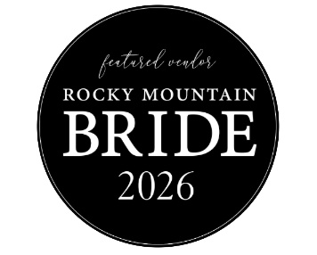Black circular logo badge with white text reading 'Rocky Mountain Bride 2026' and 'featured vendor' in elegant typography.