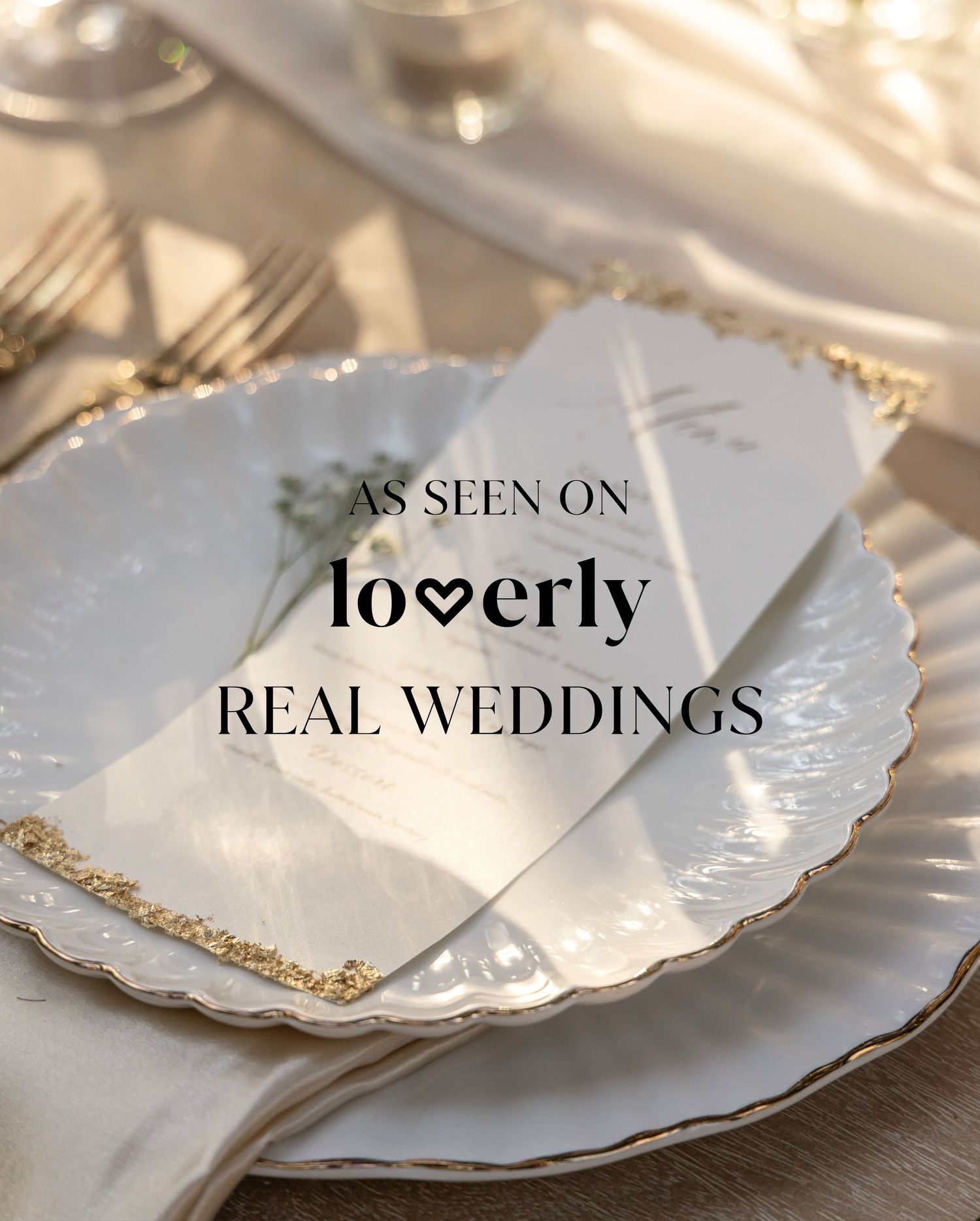Elegant wedding table setting with gold-rimmed plates and a menu card, featured on Loverly Real Weddings.