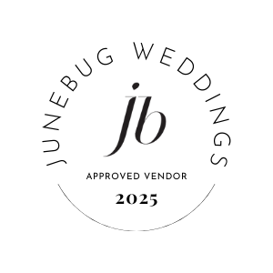 A stylized black 'JB' monogram logo design on a dark background.