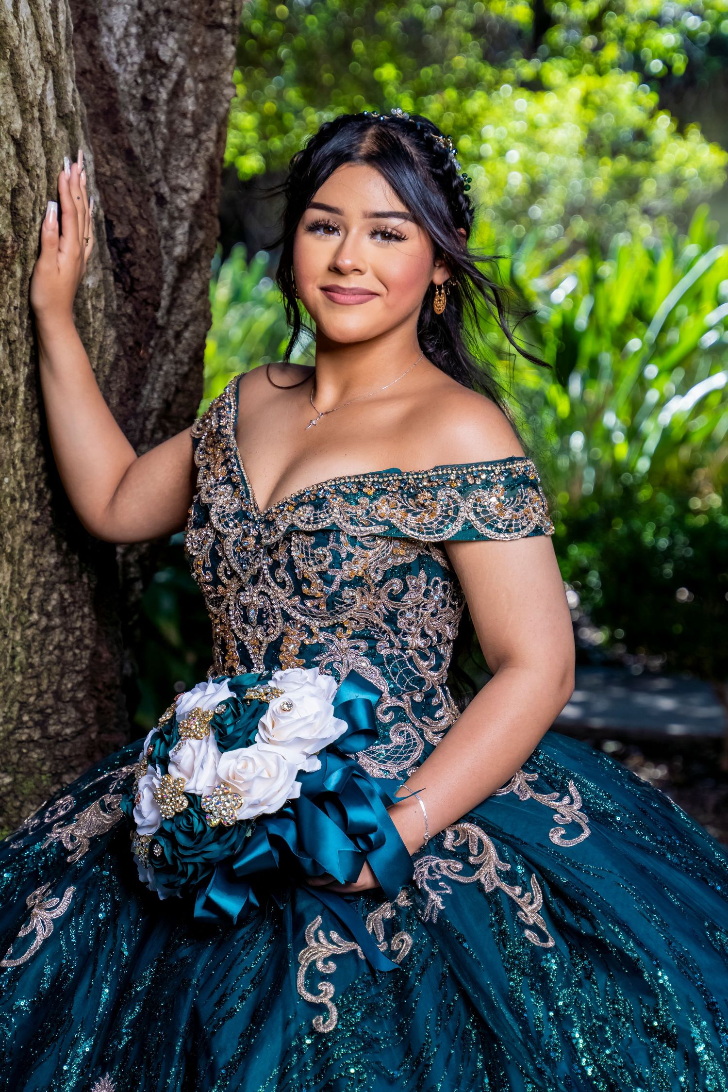 Elegant ball gown in deep blue with intricate beading and embellishments against lush garden backdrop. san fernando.