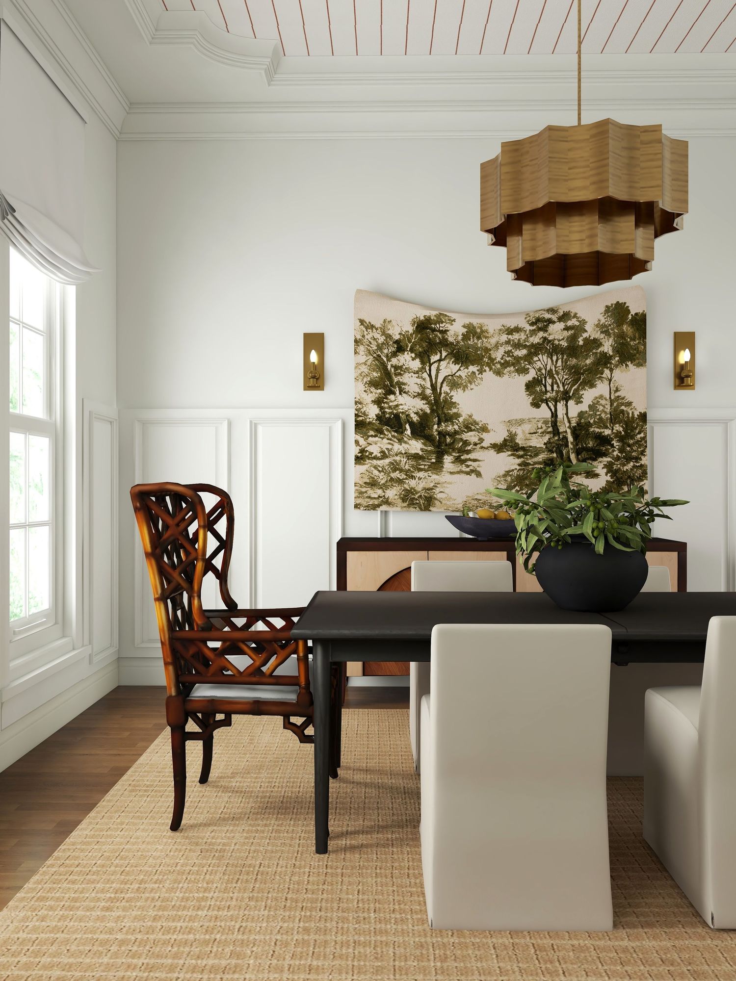 Modern traditional dining room with slipcovered chairs, rattan armchair, black table, vintage landscape art, and warm layered neutrals.