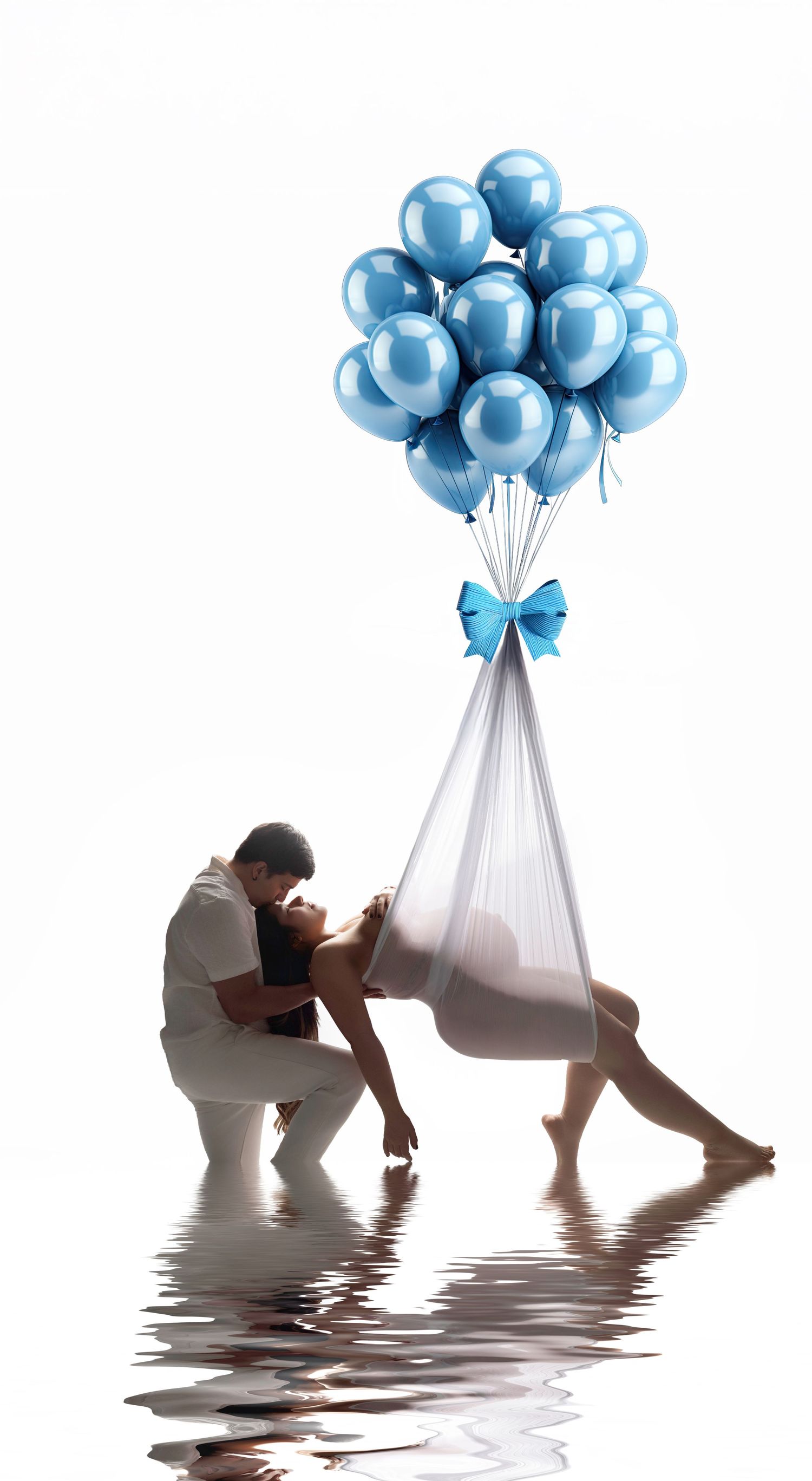 Couple embracing near water with blue balloons and white fabric, celebrating a baby boy gender reveal.