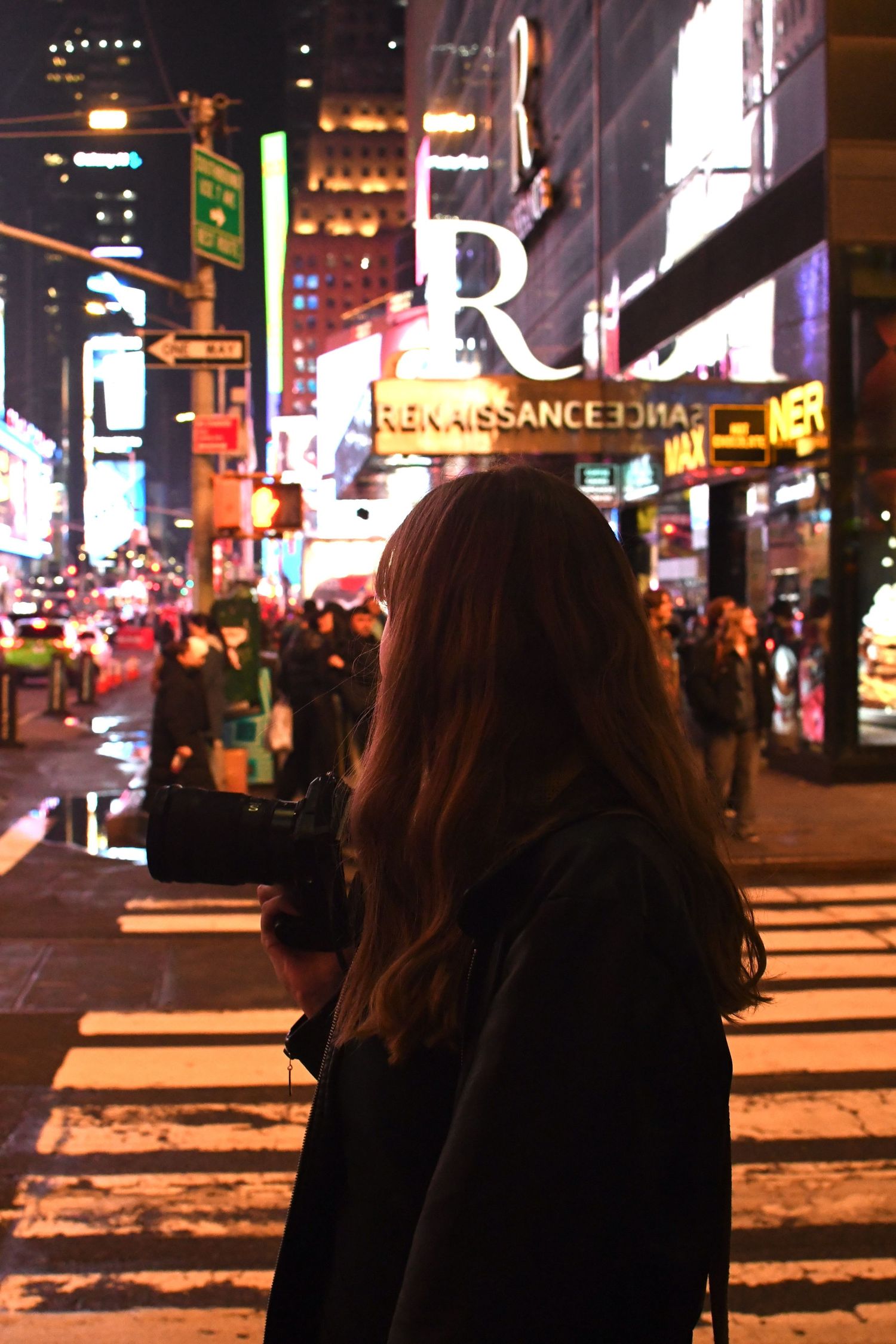 A nighttime photo series showing illuminated city streets with bright neon signs and billboards.