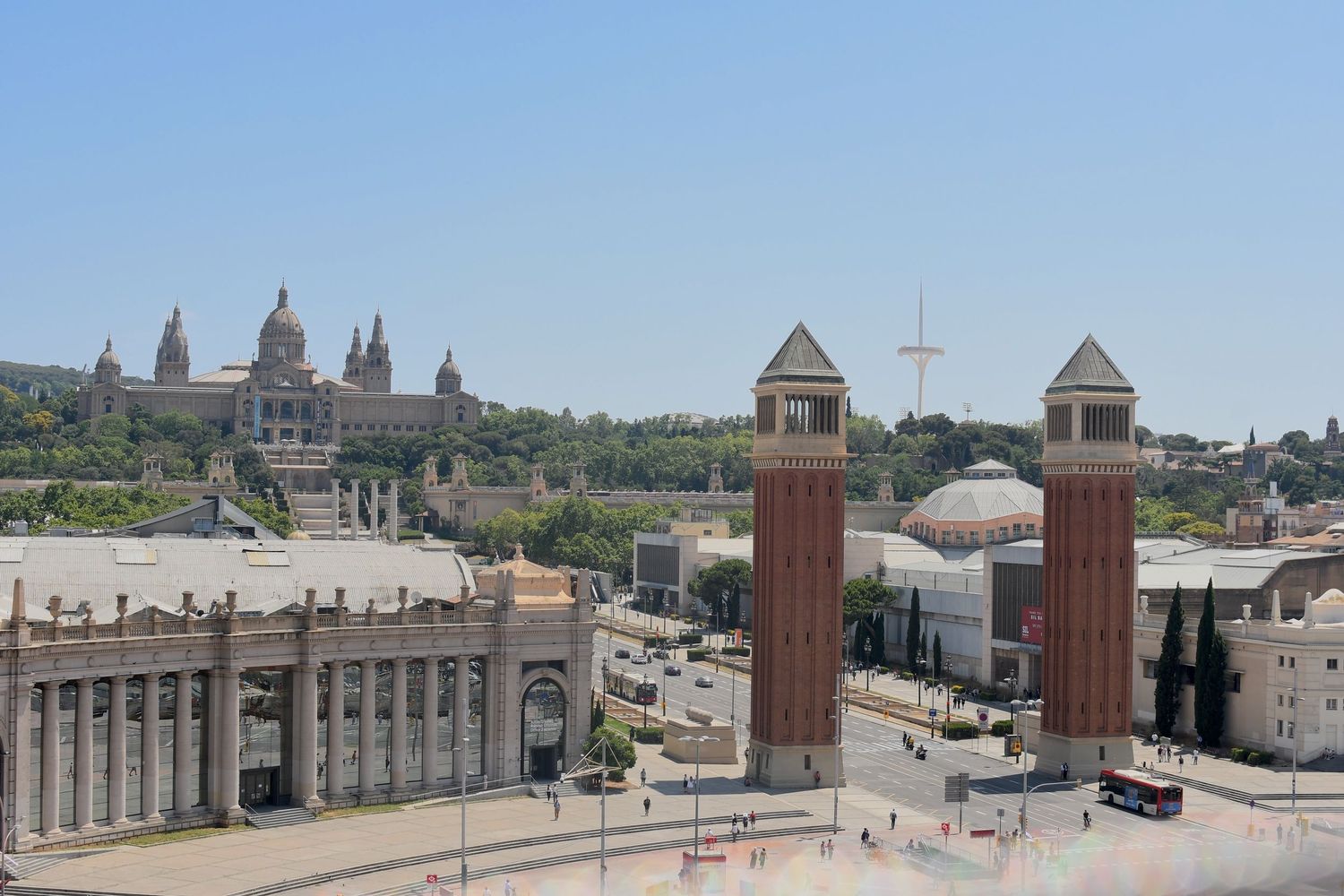 Panoramic view of historic European city plaza with grand church domes and architecture.