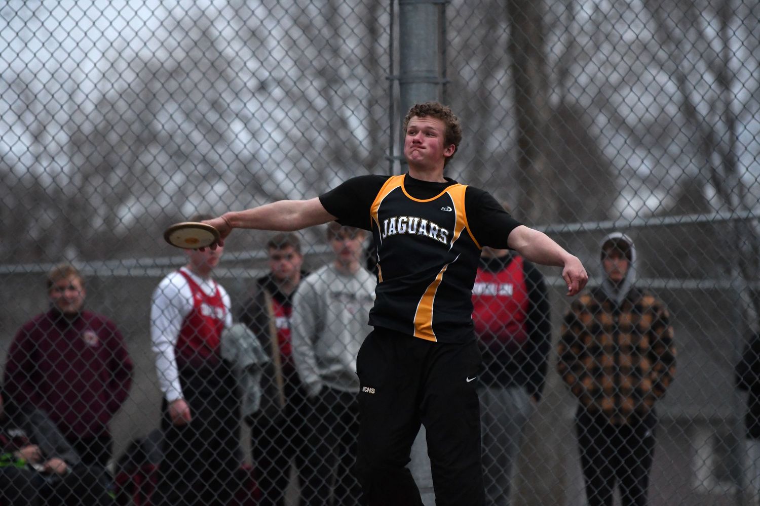 Long jumpers practice their technique during outdoor track event.