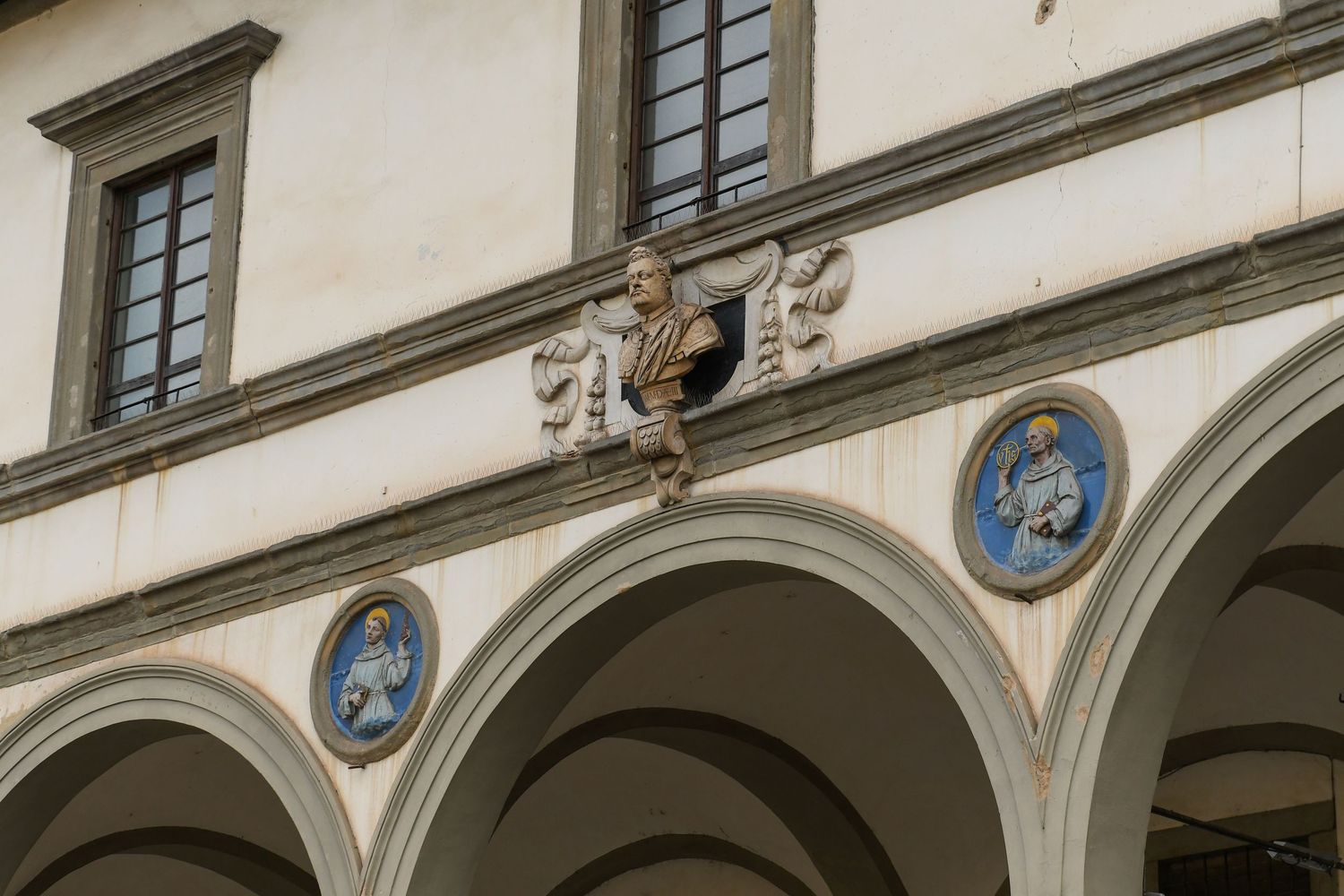 Ornate baroque architecture with decorative elements and arched windows in a historic European building interior.