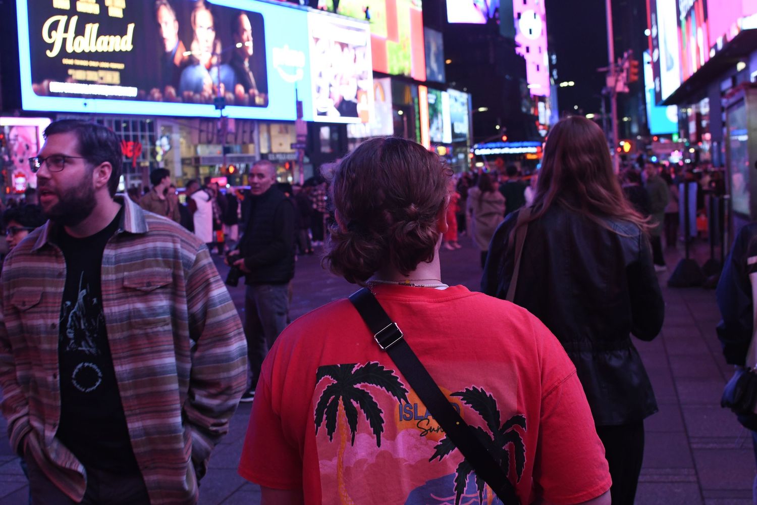 Multiple nighttime shots of a busy city street with colorful neon signs and pedestrians.