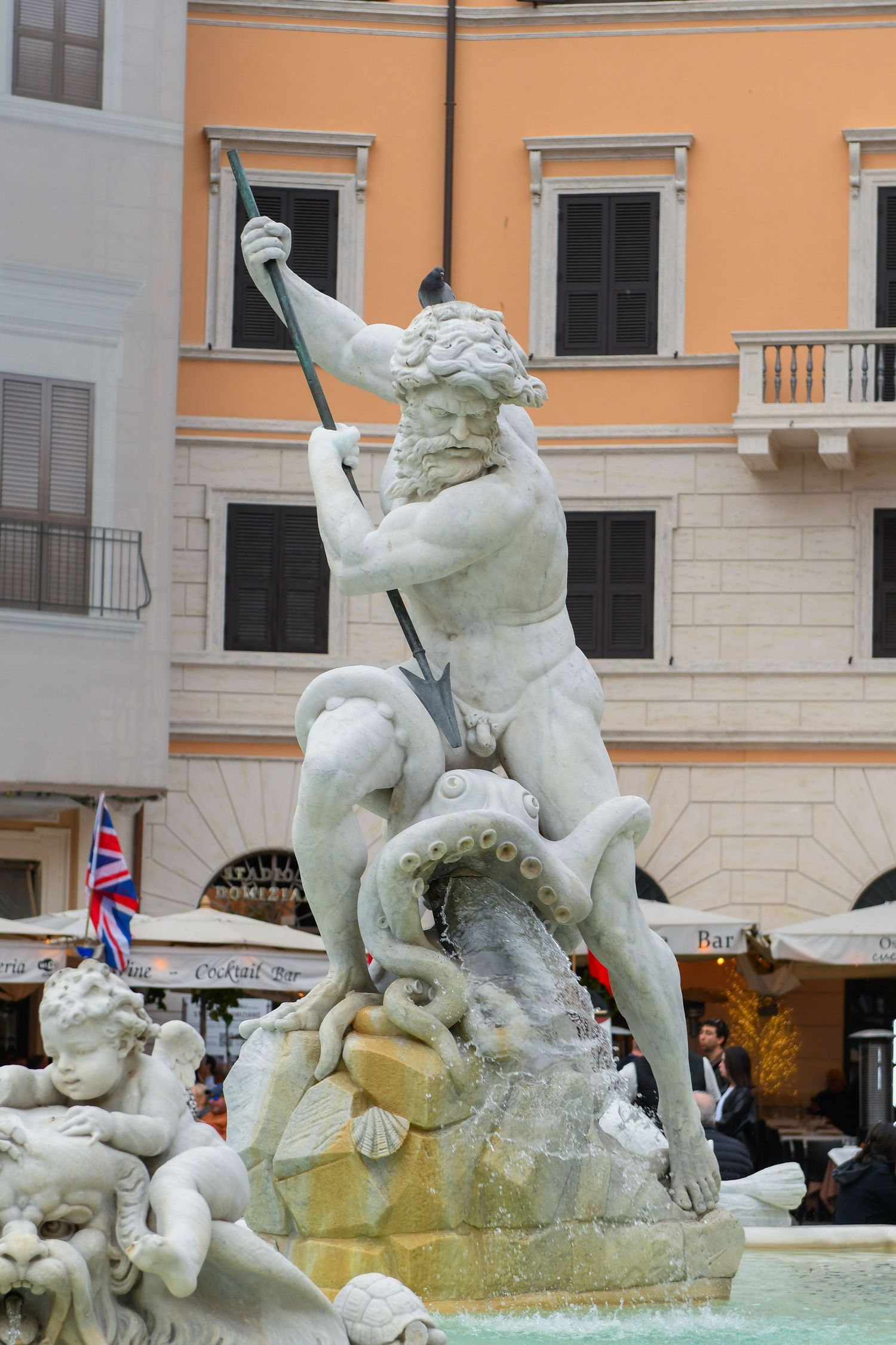 White marble fountain sculptures of mythological figures in Piazza Navona, Rome.