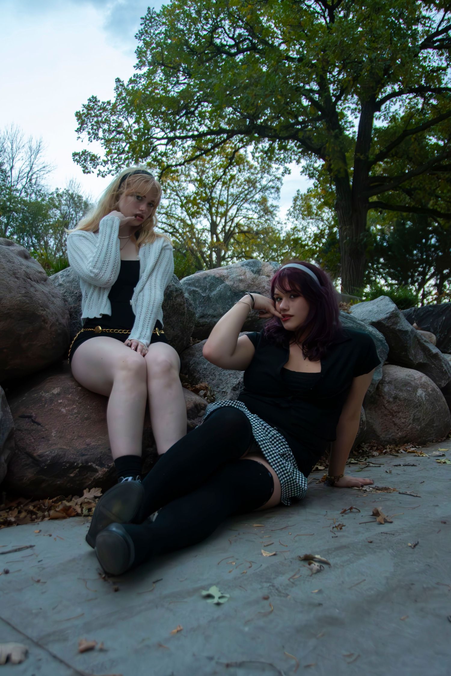 A sequence of playful poses on rocks at dusk showing relaxed moments with a beverage.