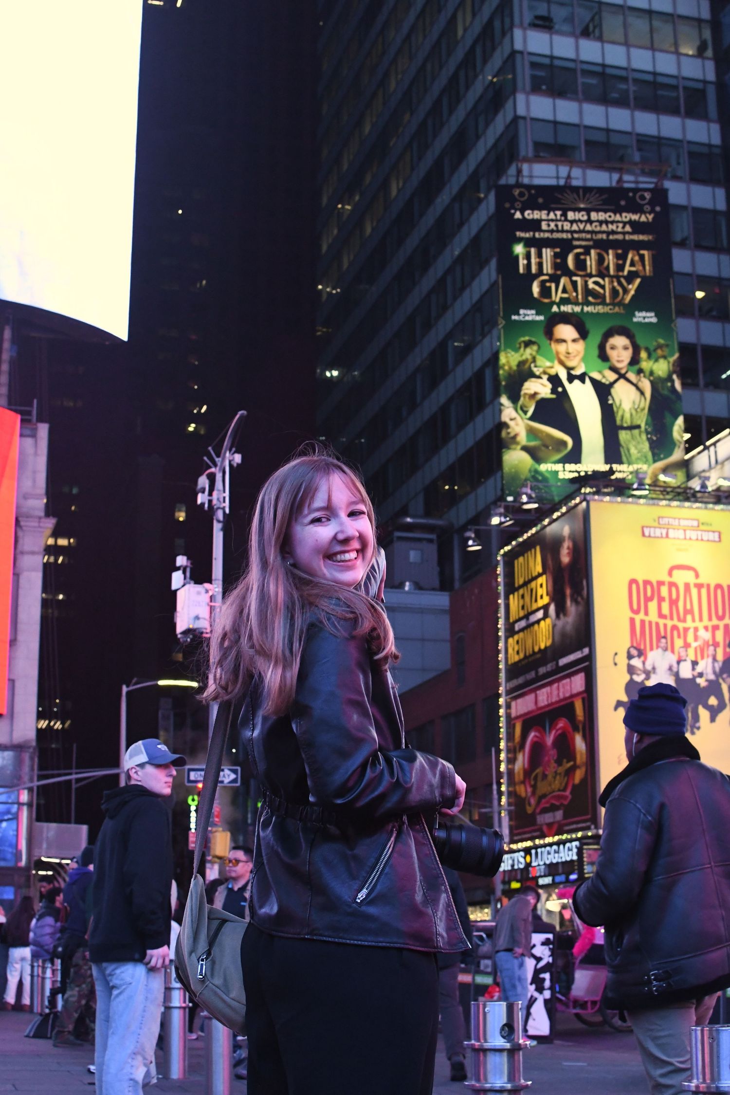 A sequence of nighttime photos in Times Square with bright theater marquees and billboards visible.