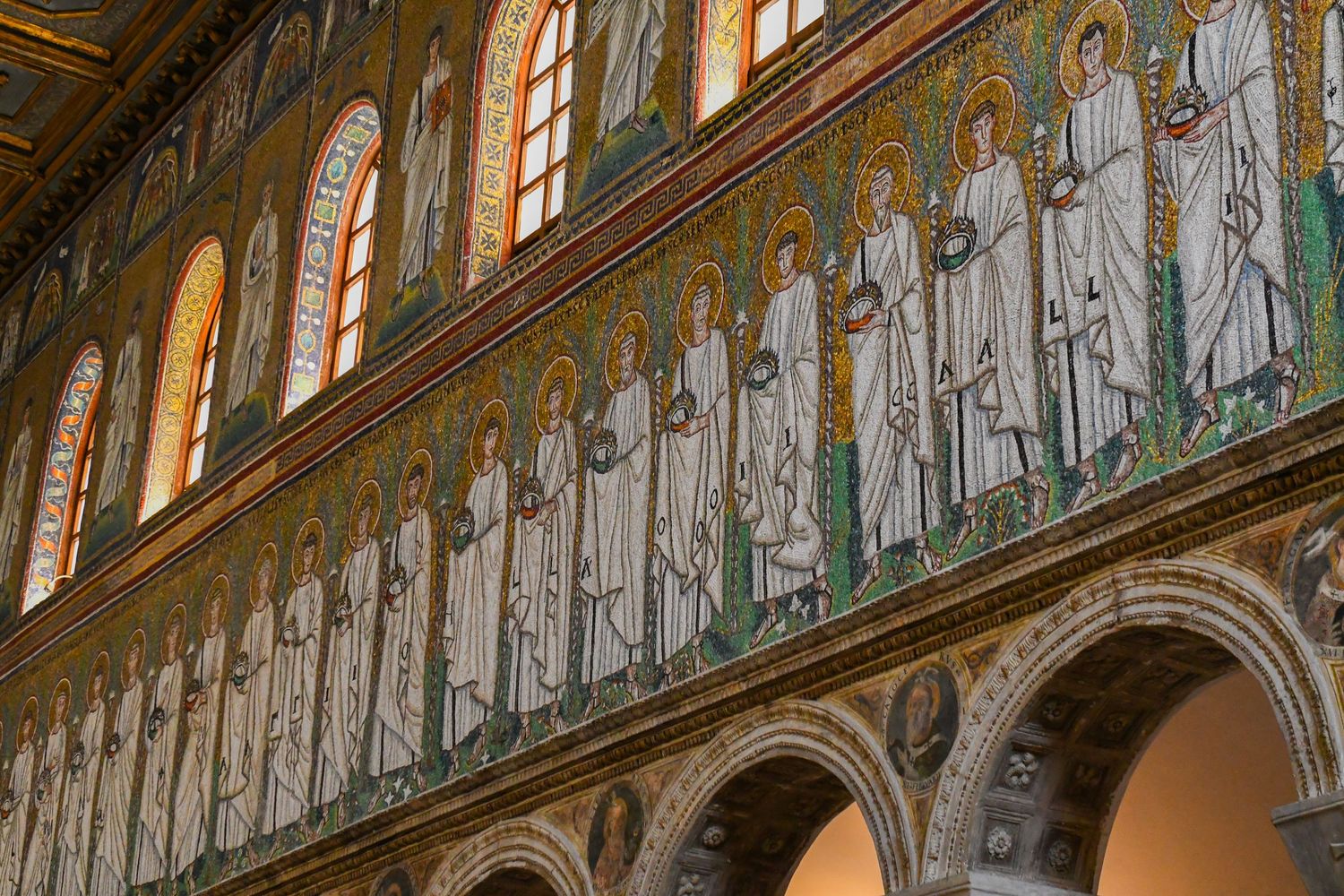Medieval religious frescoes and mosaics adorning church walls and arches.