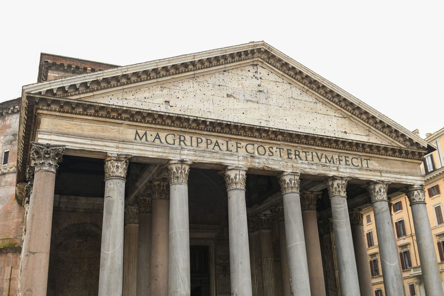 Front facade of the Pantheon in Rome with its iconic classical columns and triangular pediment.