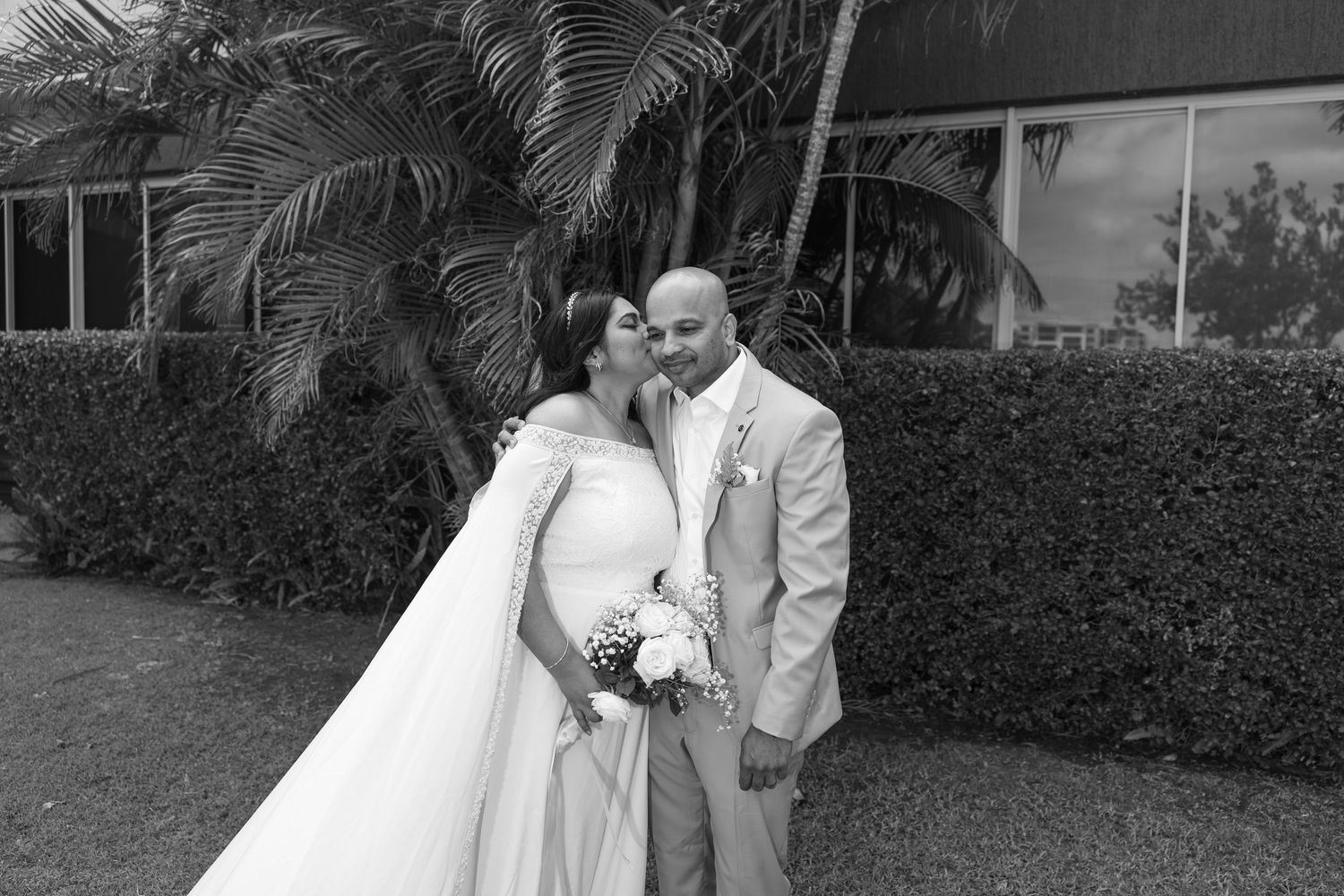 Romantic couple kiss captured candidly by Sunshine Coast wedding photographer