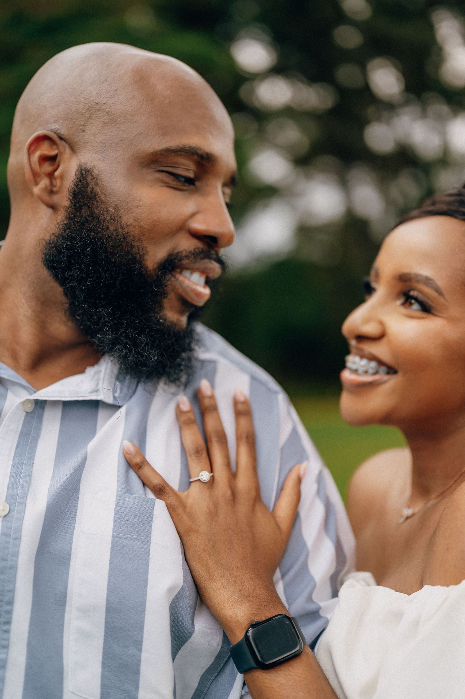 Close-up sequence of joyful moments between couple in blue striped shirt and white dress.