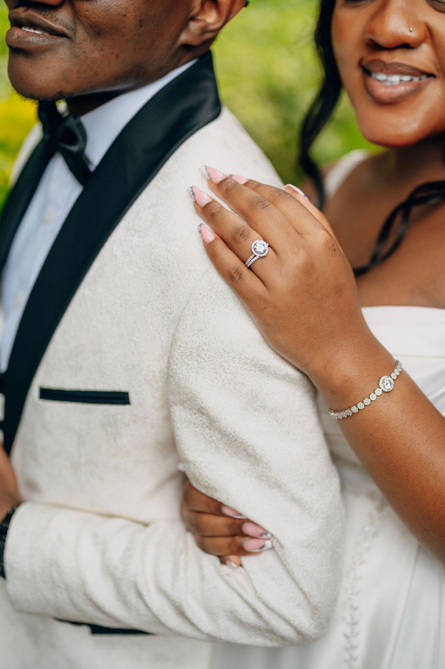 Close-up shots of hands and jewelry during intimate wedding moments.