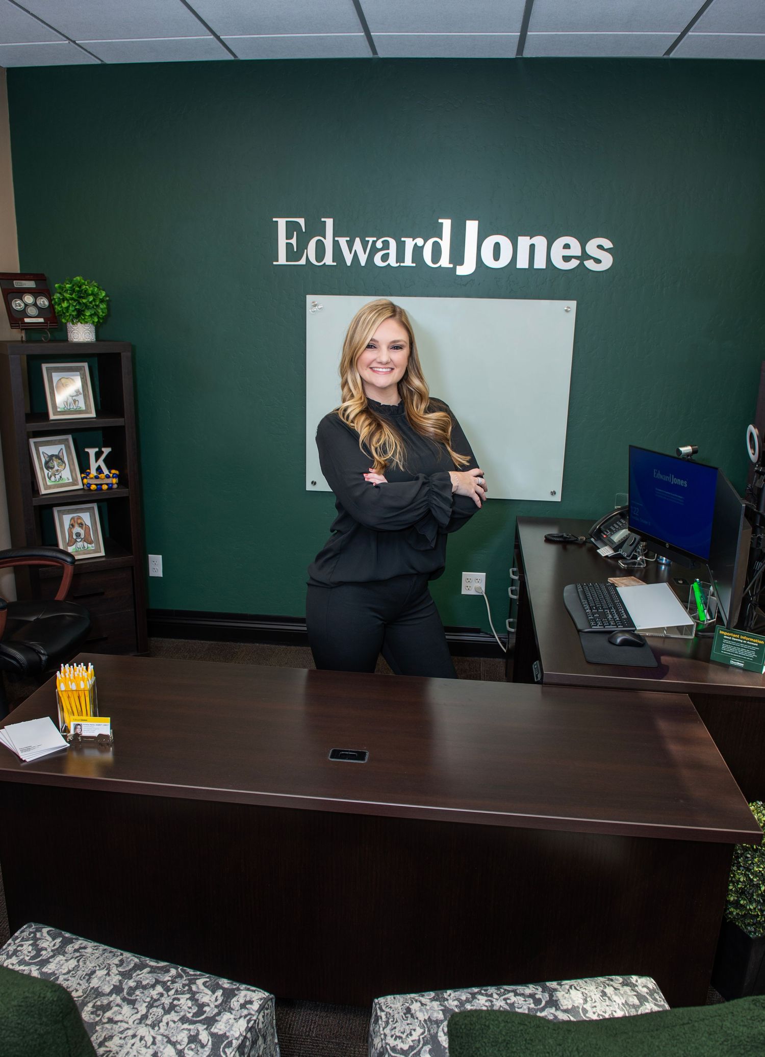 Professional office photos at Edward Jones with dark wood desk and green walls.