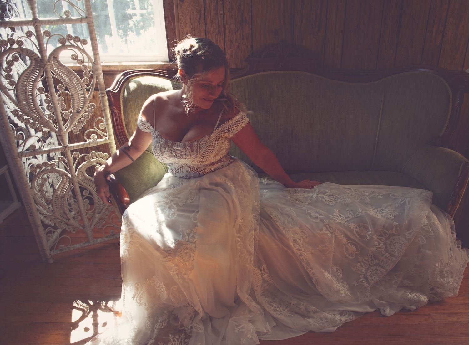 A romantic photo series featuring a couple dancing in formal attire on an ornate iron bed.