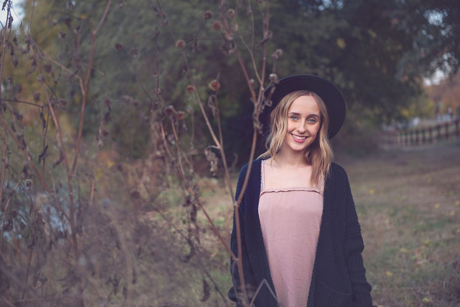 Series of outdoor portrait shots in a rustic woodland setting during fall.