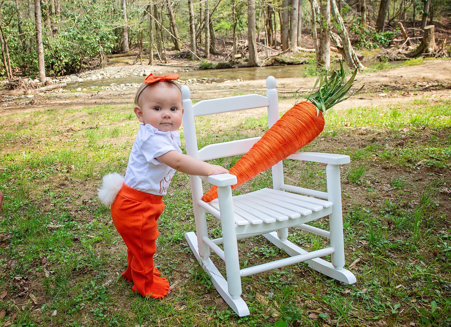 Series of photos showing baby in bright orange pants playing with white rocking chair outdoors.
