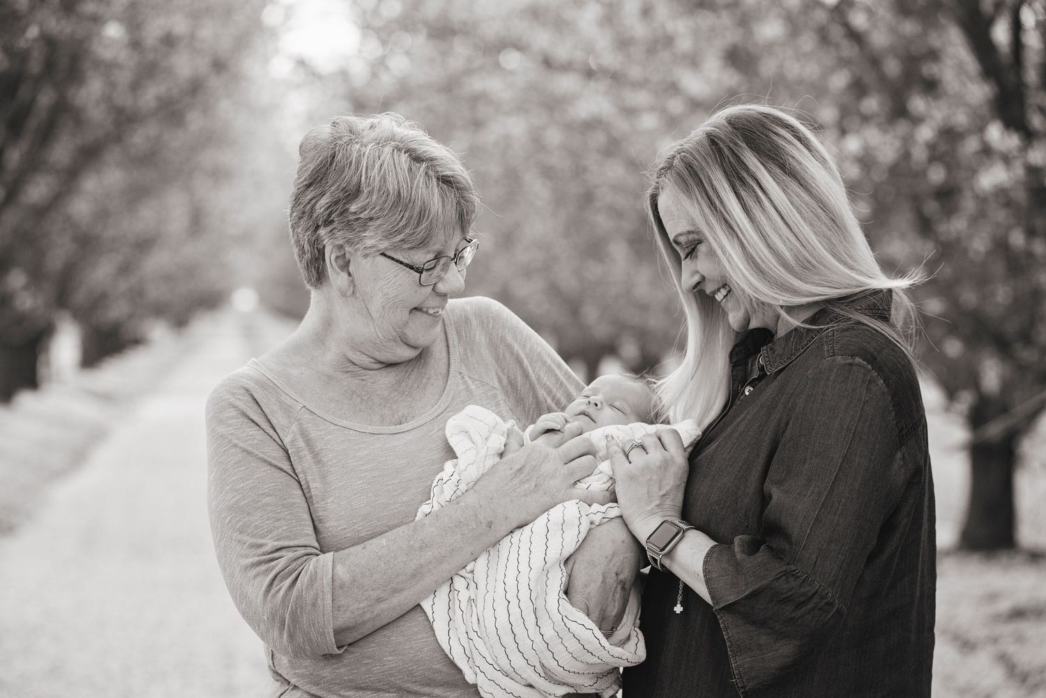 Black and white portrait of tender moment with newborn baby.