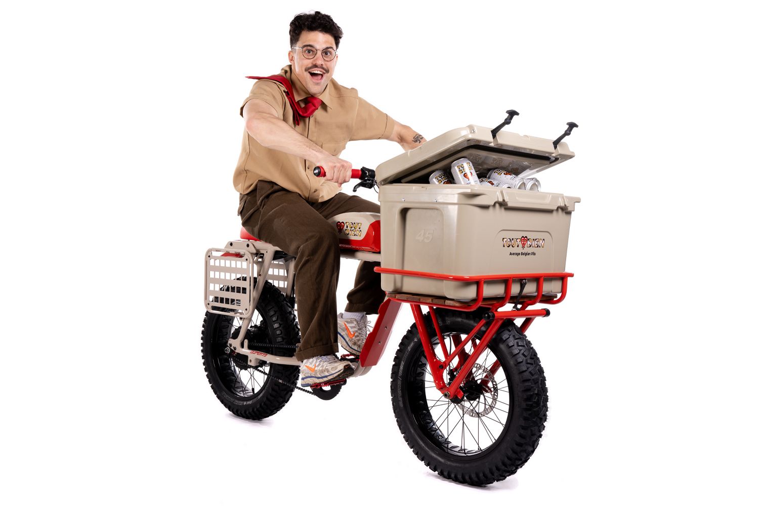Red and white vintage-style motorcycle with custom details and rugged tires.