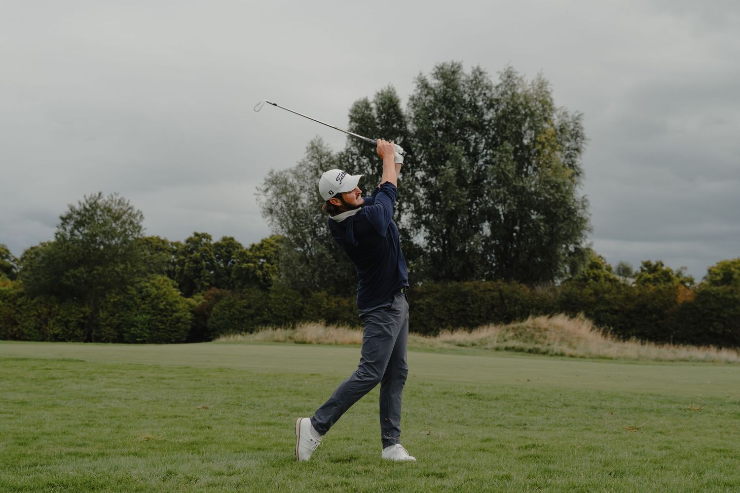 Series of shots showing a golfer's careful approach and stance on the course.