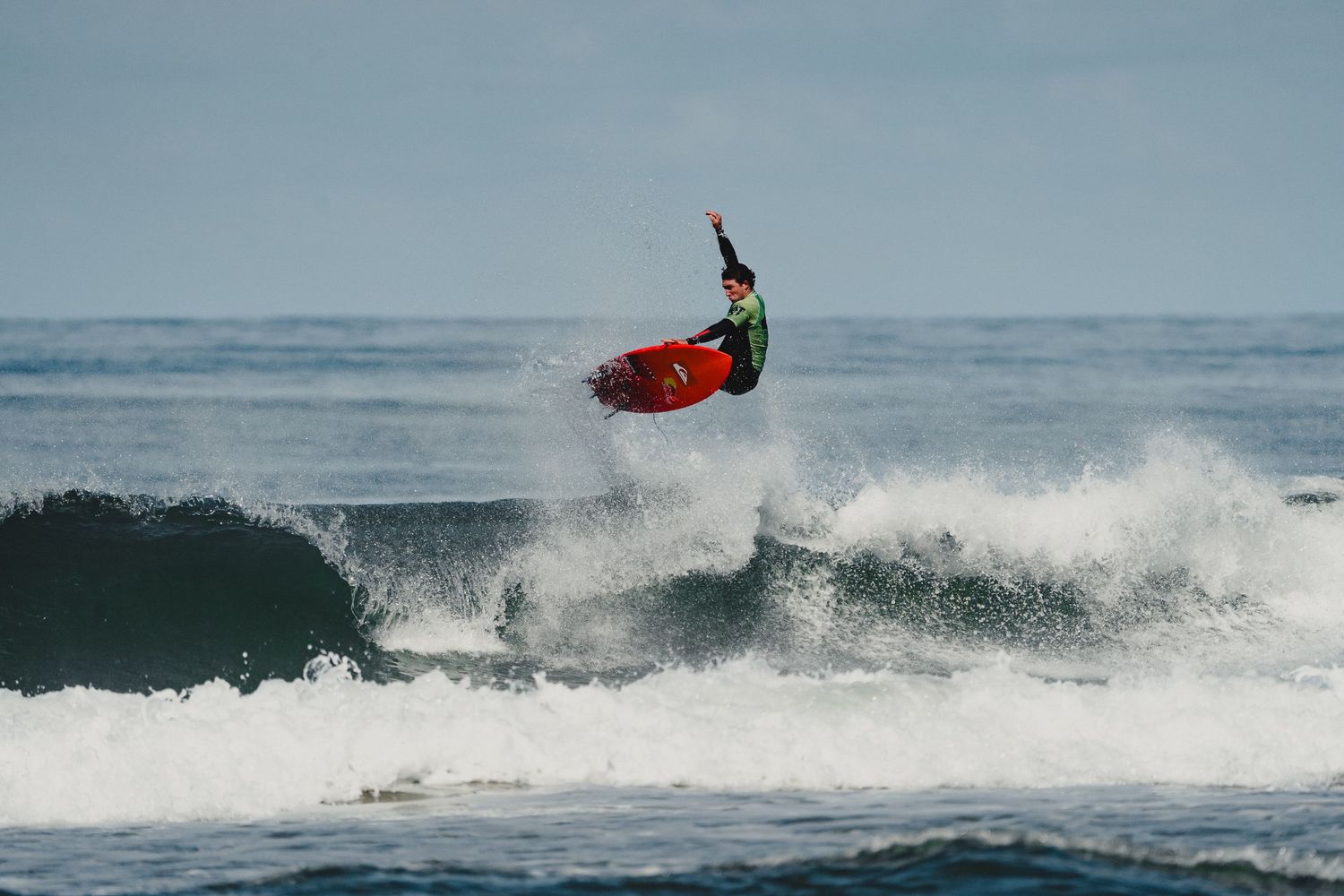 Multiple action shots of surfers performing aerial maneuvers on ocean waves.
