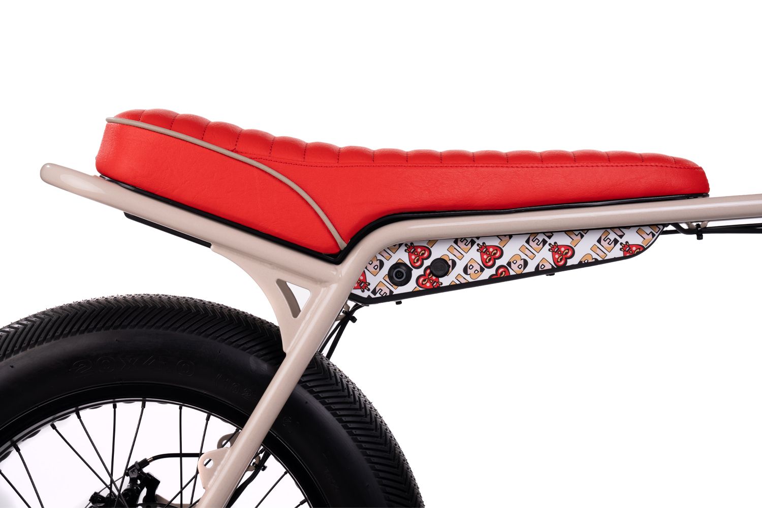 Close-up of red leather motorcycle seat stitching and design elements.