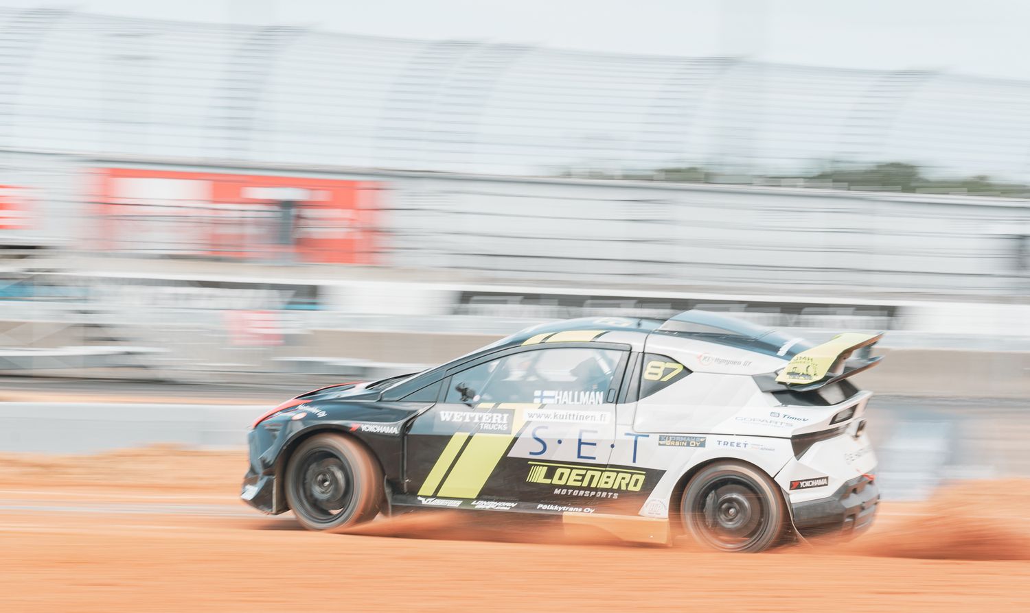 A race car drifting during a race.