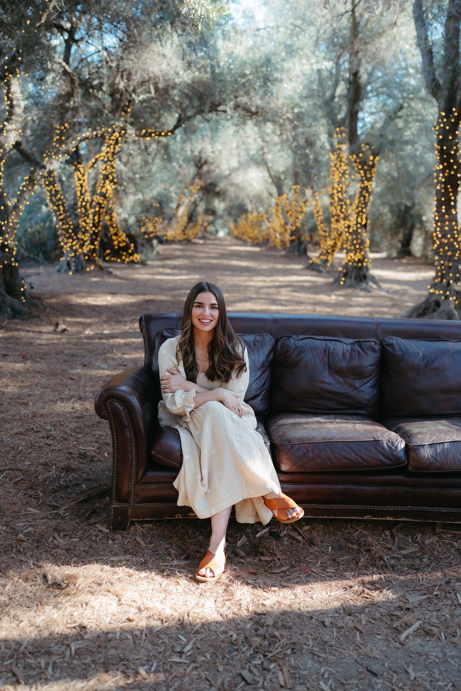 Warm golden hour environmental portrait of a woman in a sunlit field in Southern California by Vince Shewmaker.
