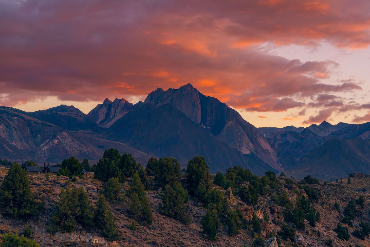 Dramatic wide-angle nature photograph of majestic mountains and under a moody sky by Vince Shewmaker.