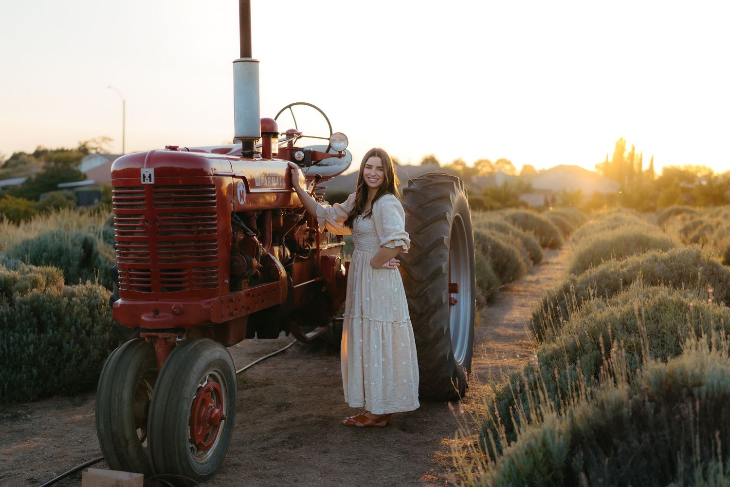 Warm golden hour environmental portrait of a woman in a sunlit field in Southern California by Vince Shewmaker.