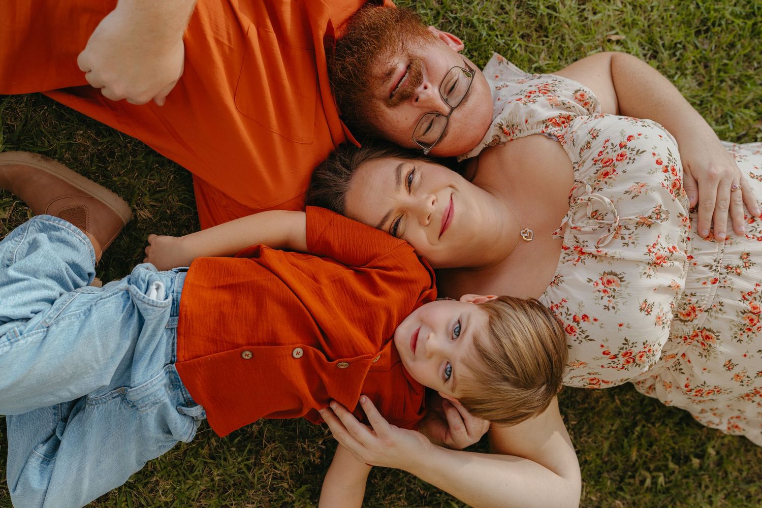 Warm golden hour environmental portrait of a family with children playing in a sunlit field in Southern California by Vince Shewmaker.