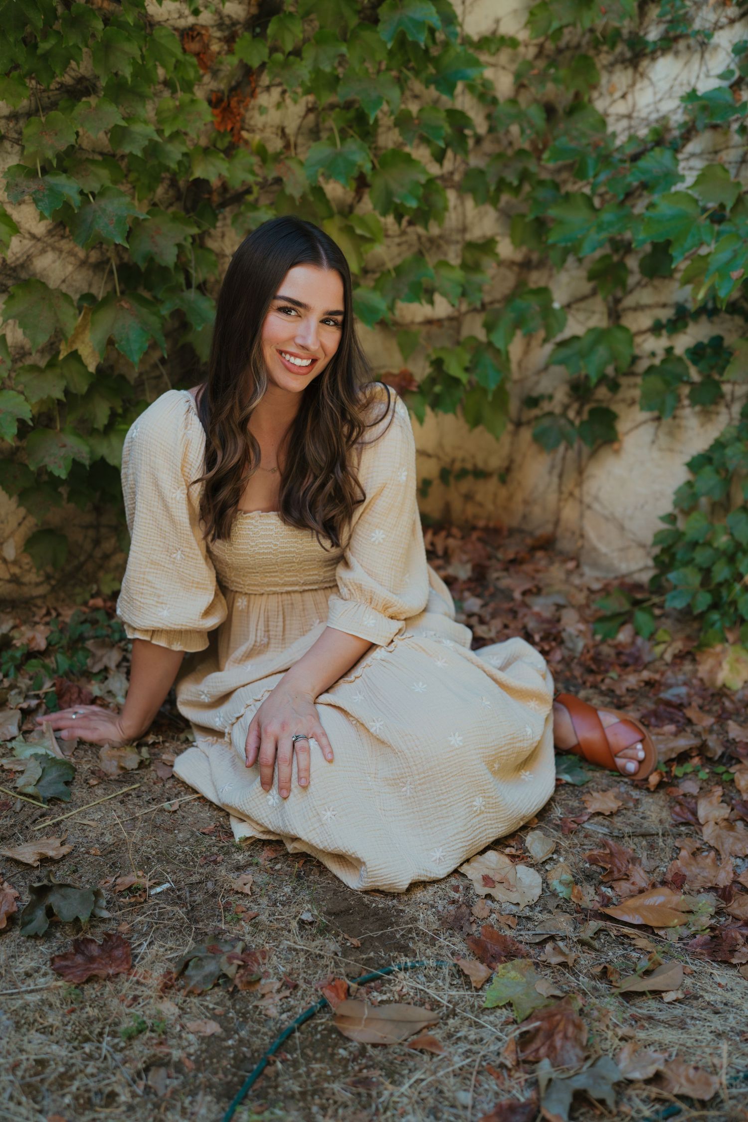 Warm golden hour environmental portrait of a woman in a sunlit field in Southern California by Vince Shewmaker.