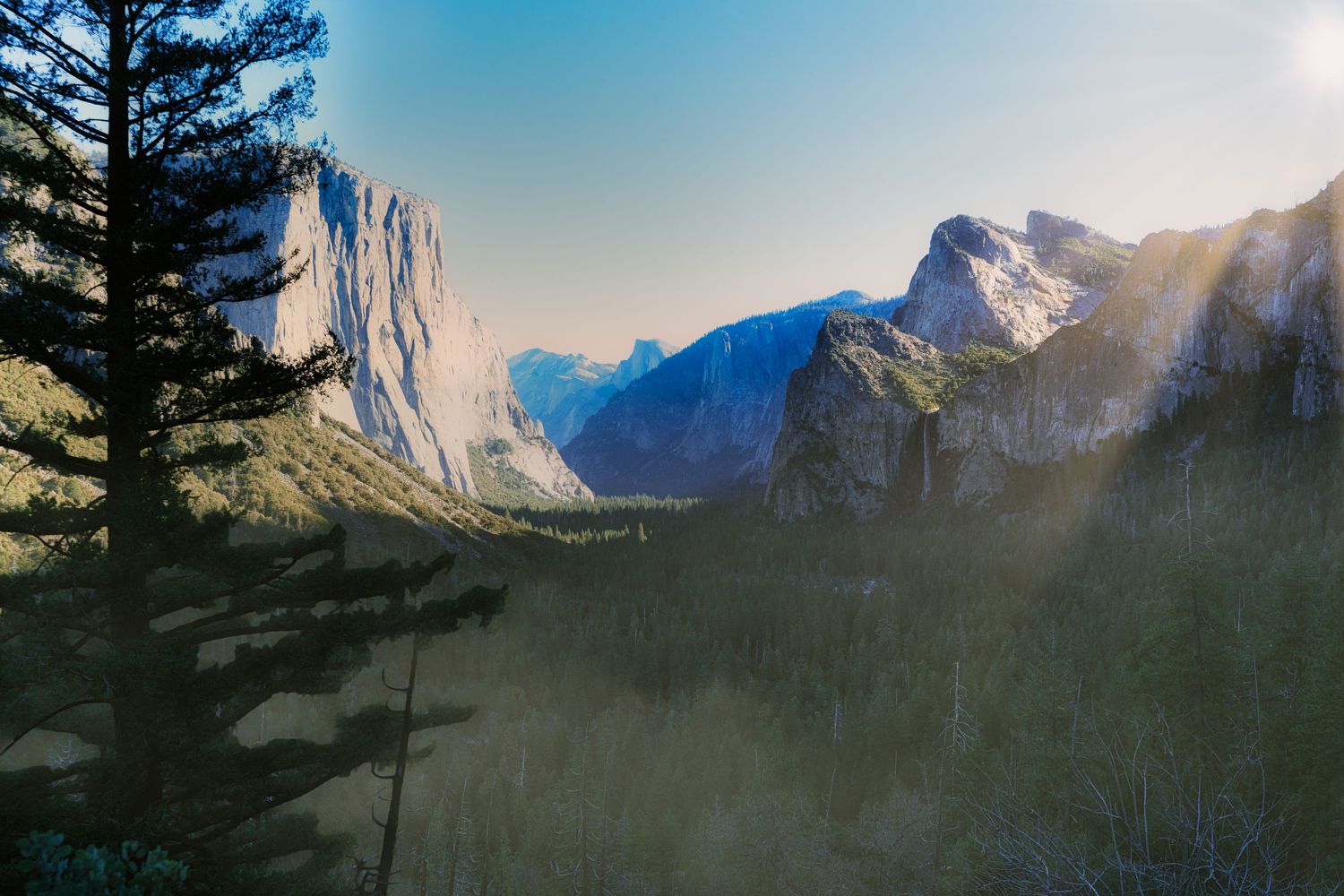 Dramatic wide-angle nature photograph of majestic mountains and under a moody sky by Vince Shewmaker.