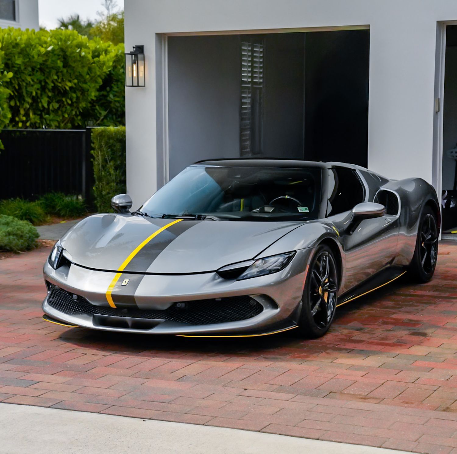 High-end Ferrari automotive photo shoot in driveway of house. Palm beach gardens florida