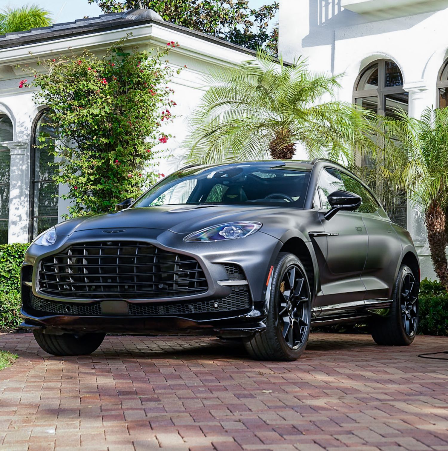 High-end Aston Martin automotive photo shoot in driveway of luxury house. Palm Beach Florida