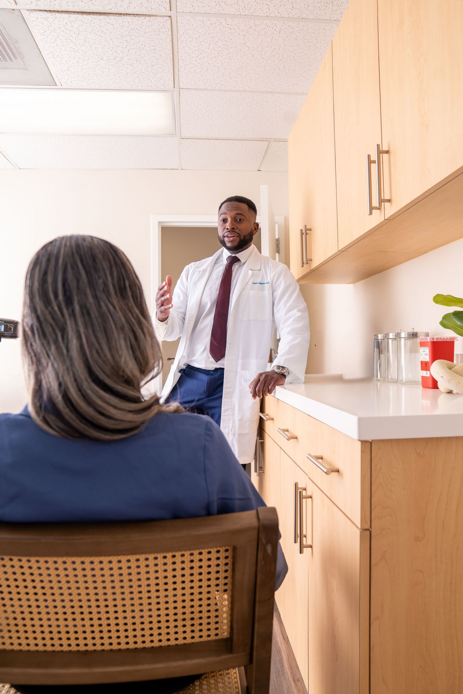 Doctor and patient branding shot. talking in office.