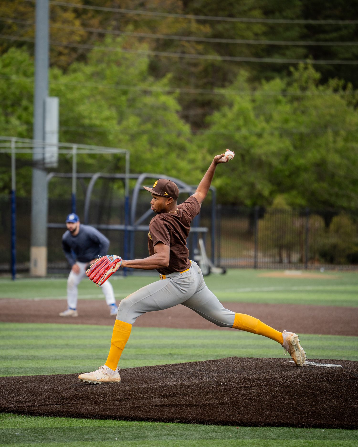 Baseball Sports Portrait action shot of Atlanta Men's Padres team pitcher throwing
