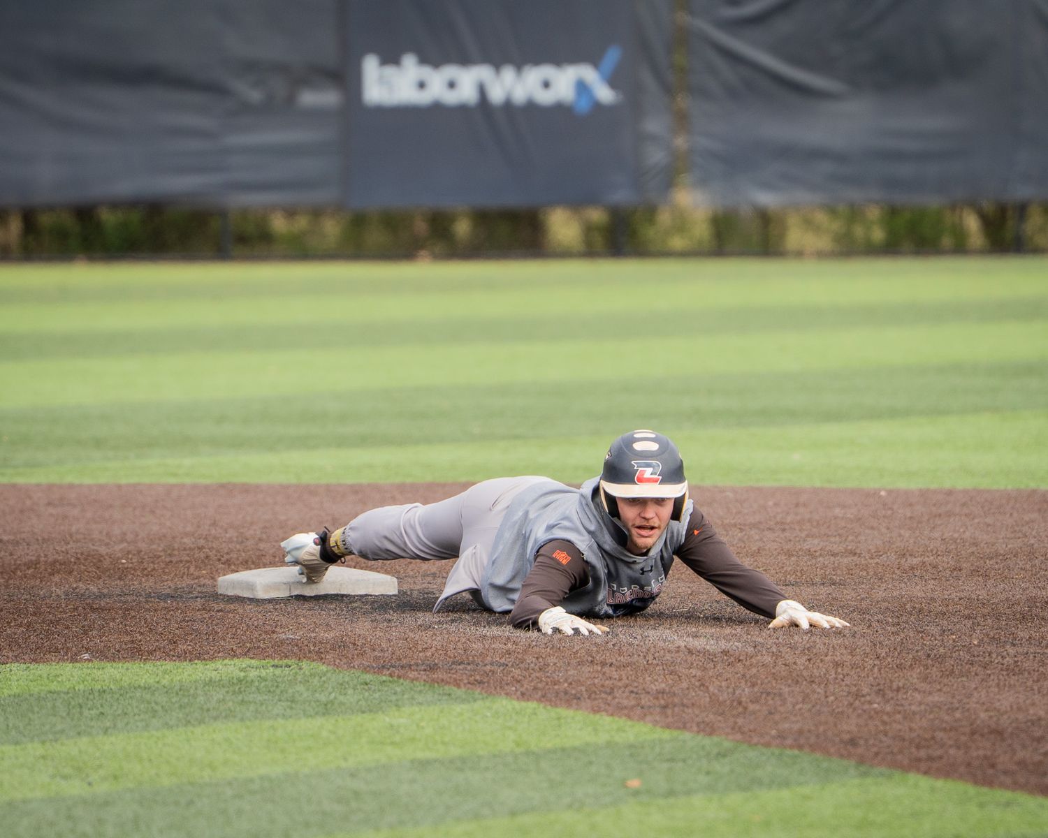 Baseball Sports Portrait action shot of Atlanta Men's Padres team runner stealing second base