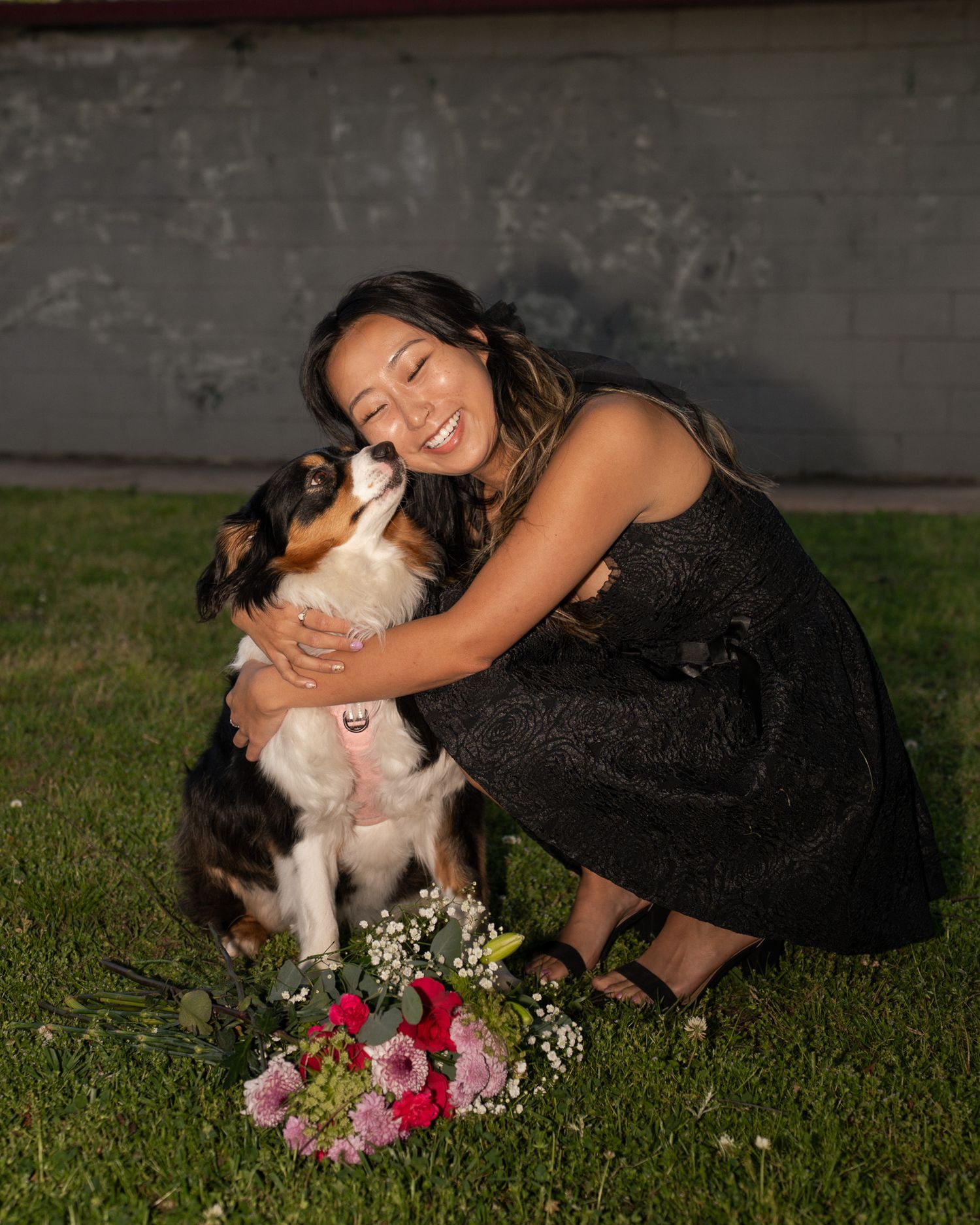 Portrait Photo at Perkerson Park in Atlanta, GA in the grass with flowers and black dress and dog