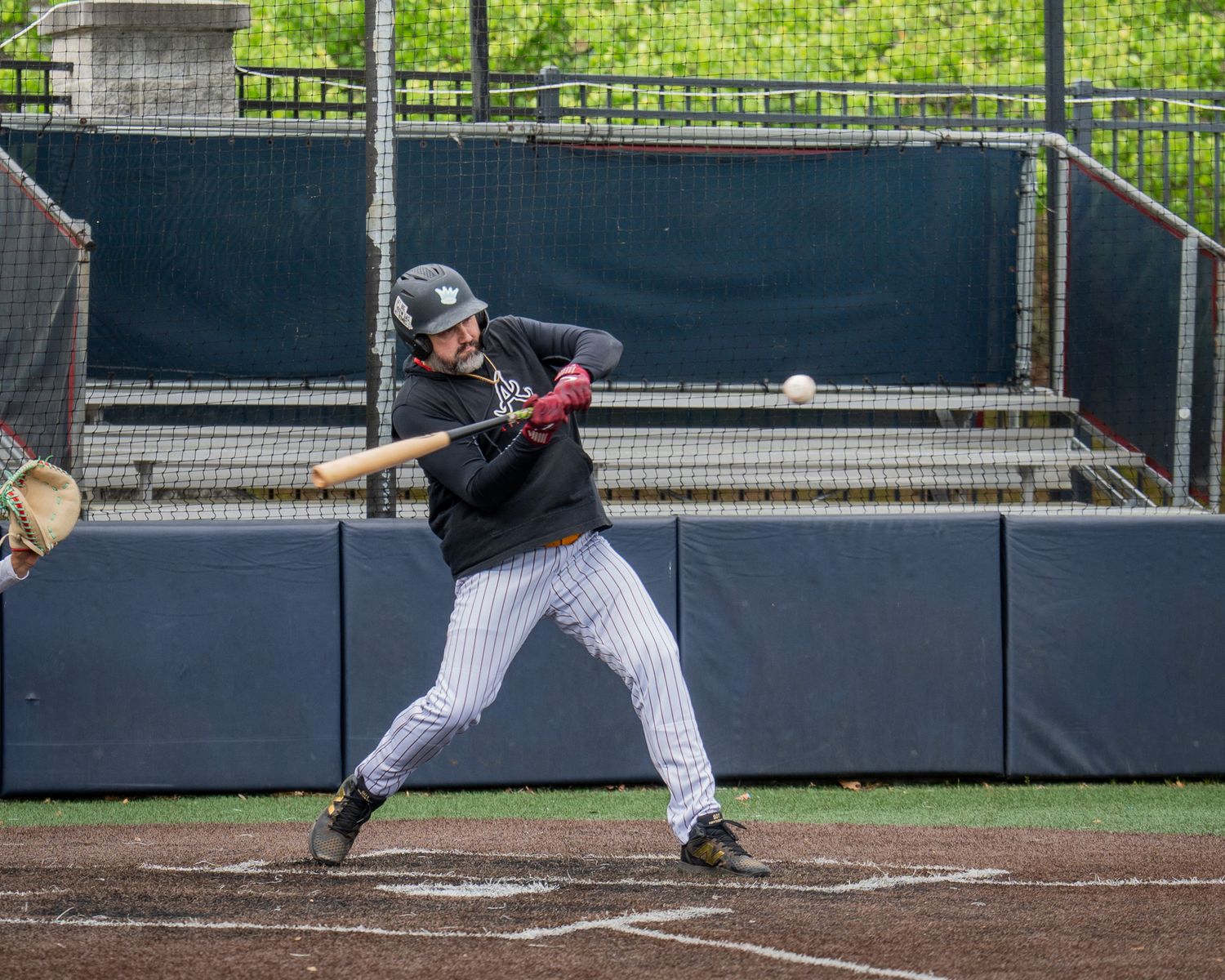 Baseball Sports Portrait action shot of Atlanta Men's Padres team batter swinging