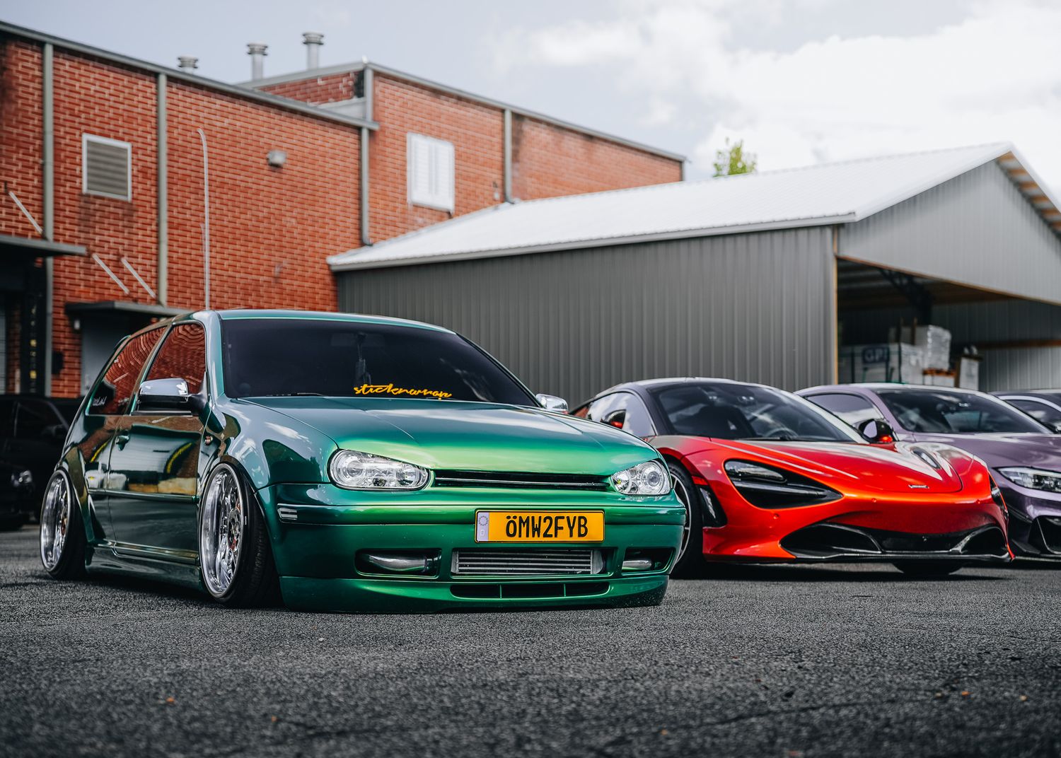 Green VW Golf and red McLaren Car Photography at GAS ATL car show
