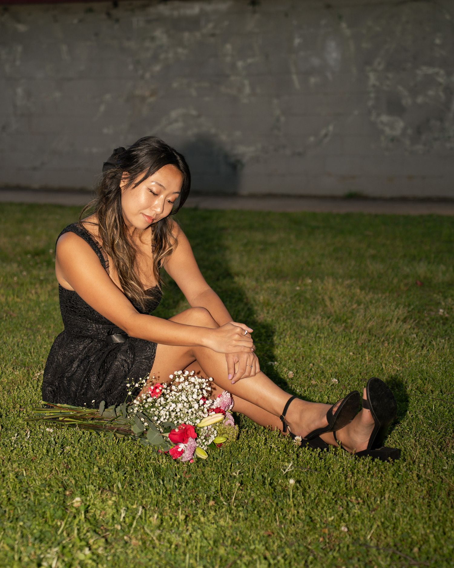 Portrait Photo at Perkerson Park in Atlanta, GA in the grass with flowers and black dress