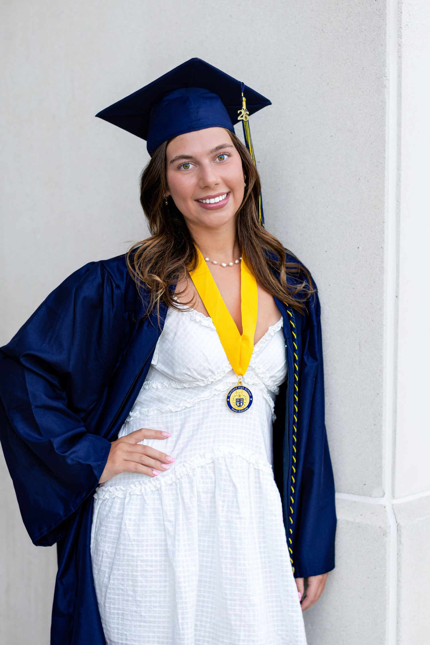 Hartland high school senior photo; cap and gown graduation portrait by South Lyon, Michigan photographer