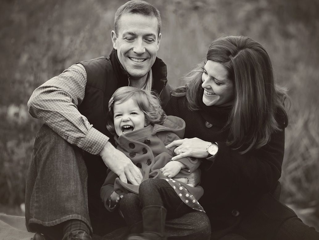Parents and toddler girl laughing in park; family portrait session in Ann Arbor, by Christie Ackroyd, Family photographer, Brighton MI