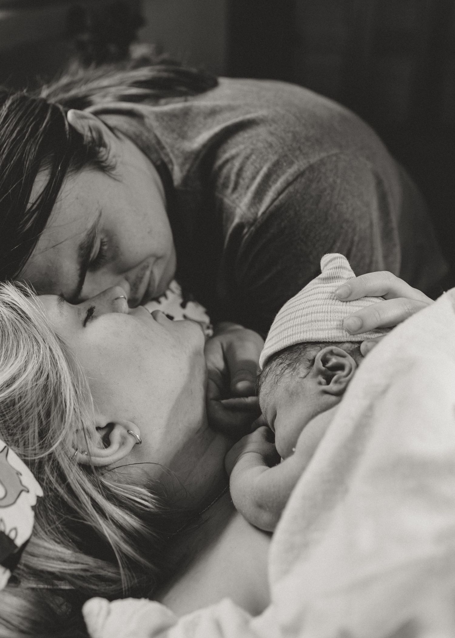 Black and white photographic strip showing a sequence of intimate close-up shots with a dreamy romantic quality.
