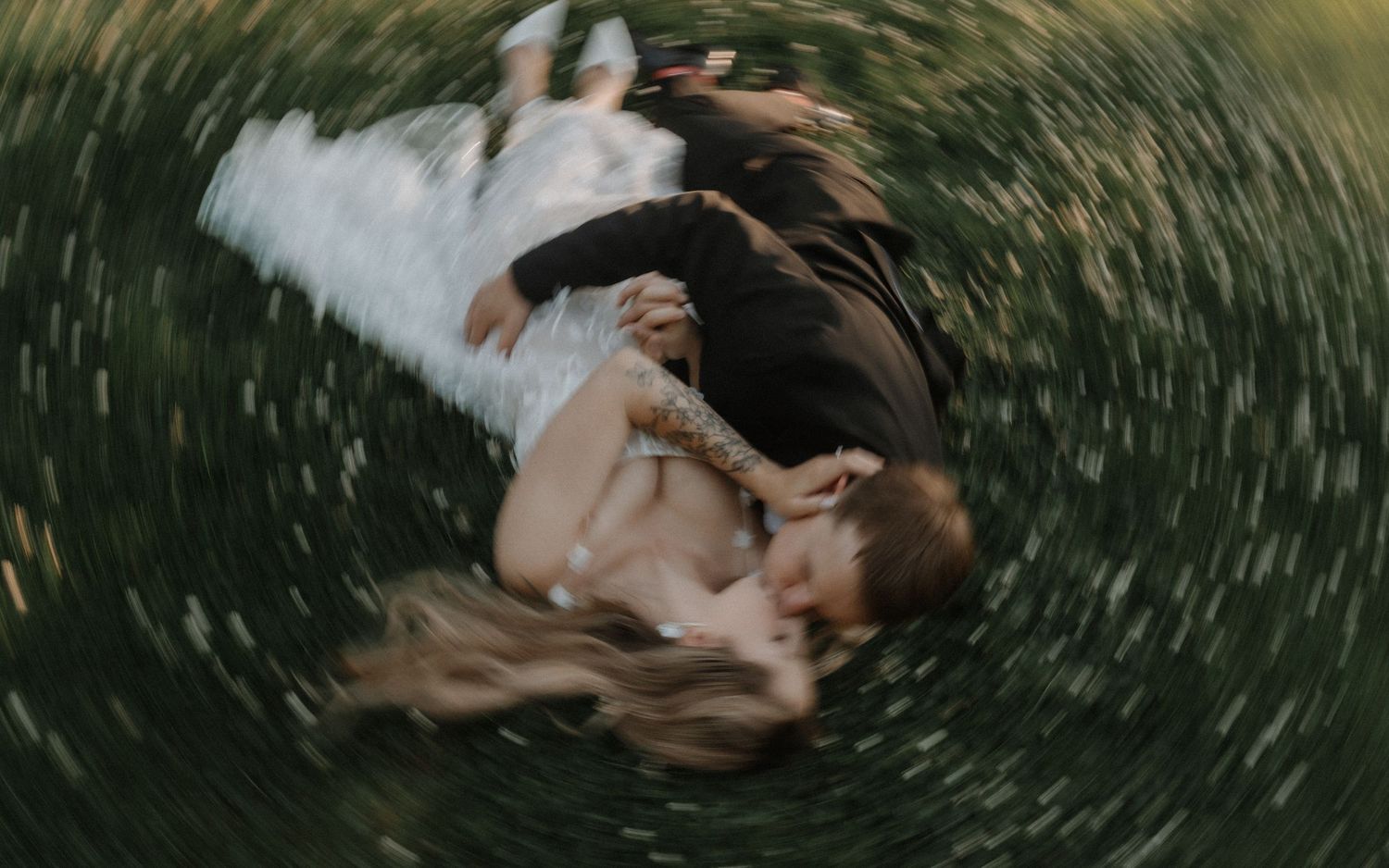 A series of spiraling motion blur photographs in a grassy outdoor setting showing artistic movement and rotation.