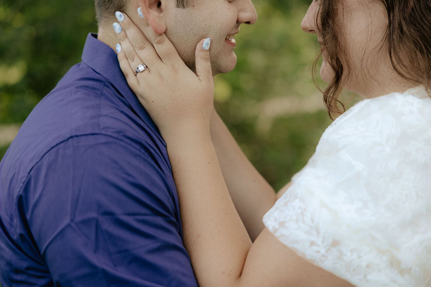 A romantic sequence of a couple sharing an intimate moment in a garden setting against greenery in their wedding attire.