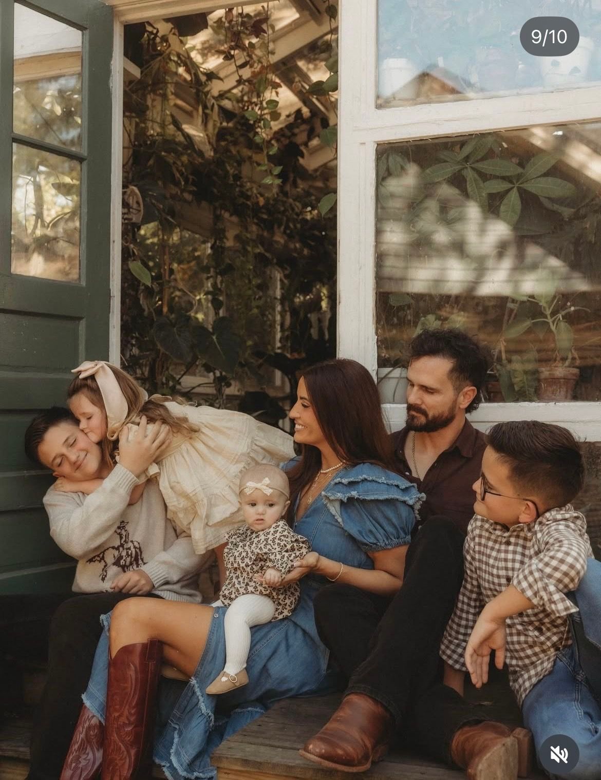 A group sits together on a porch swing, sharing laughter and playful moments in warm sunlight.
